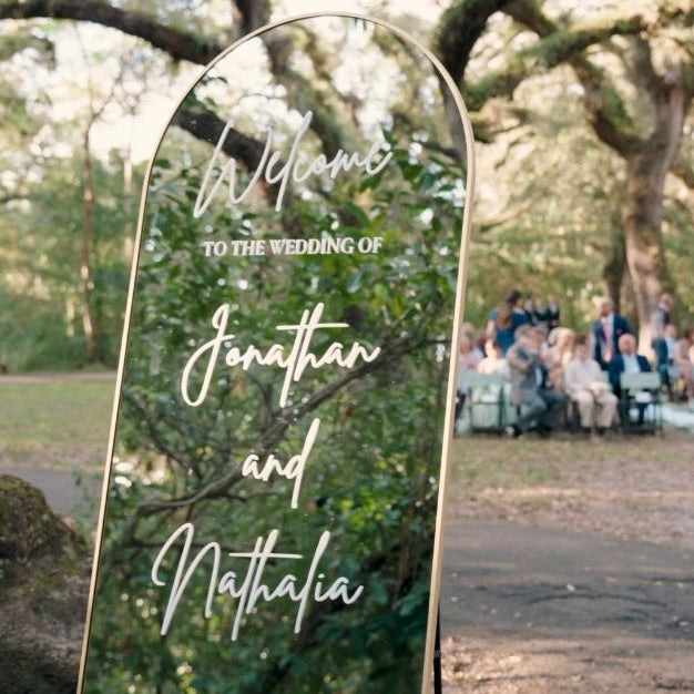 Wedding ceremony with a decorative archway in a park setting